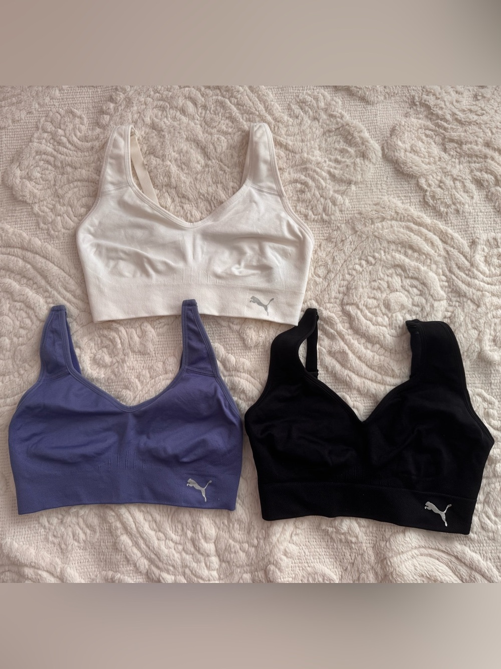 Puma Seamless Scoop Sports Bras in White, Lavender, and Black